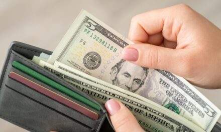 Handing over $5 bill