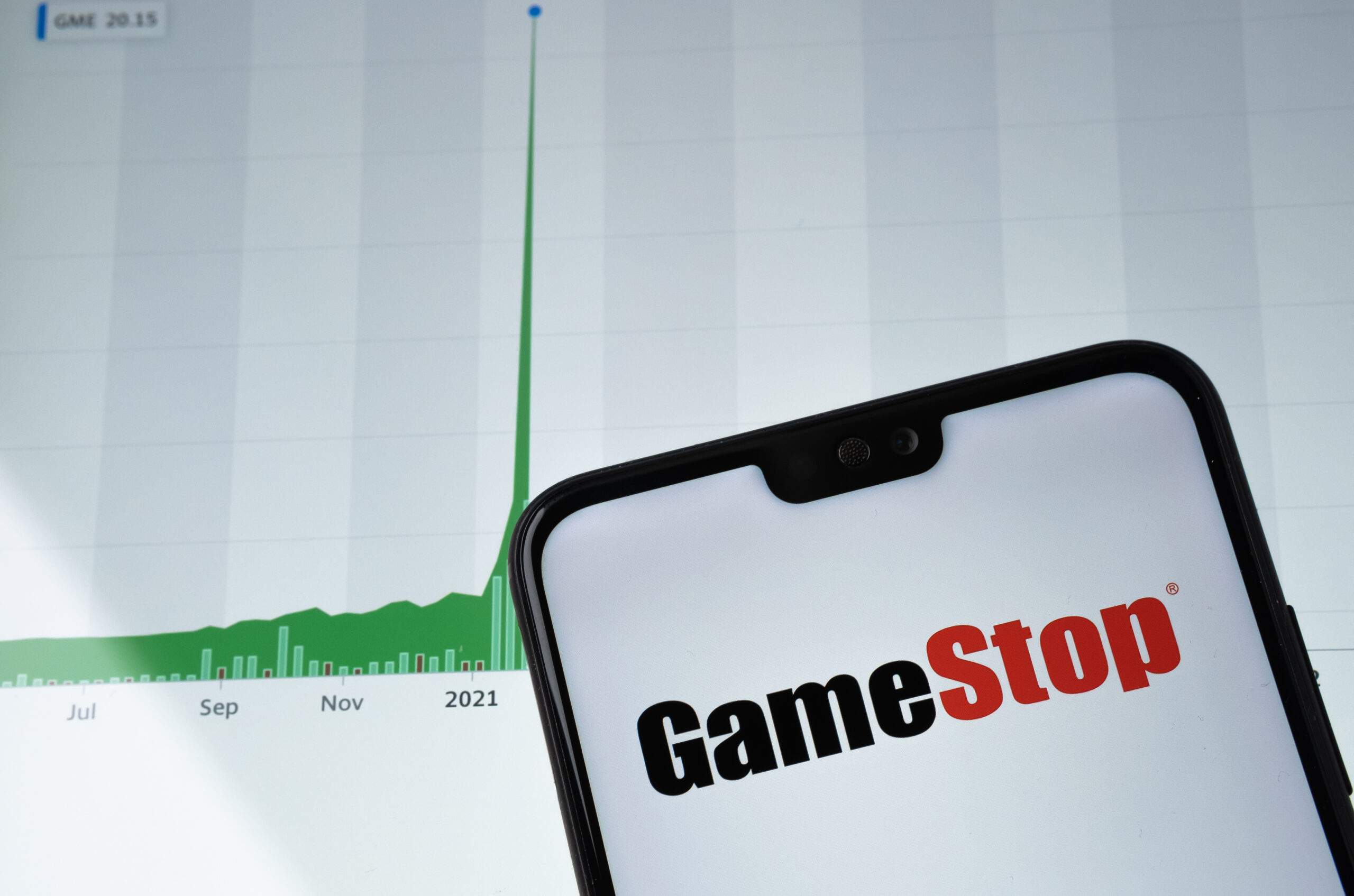 Picture of Gamestop Logo on Phone with graph trending up