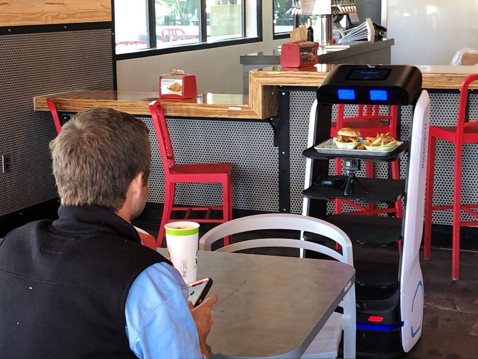 robot serving food at restaurant